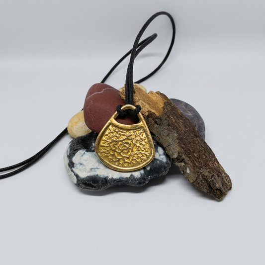 Tidied bronze pendant and leather necklace